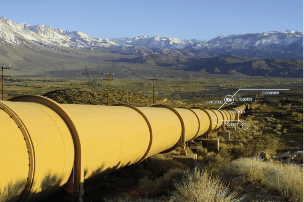 Oil pipeline running across open land in Rocky Mountains