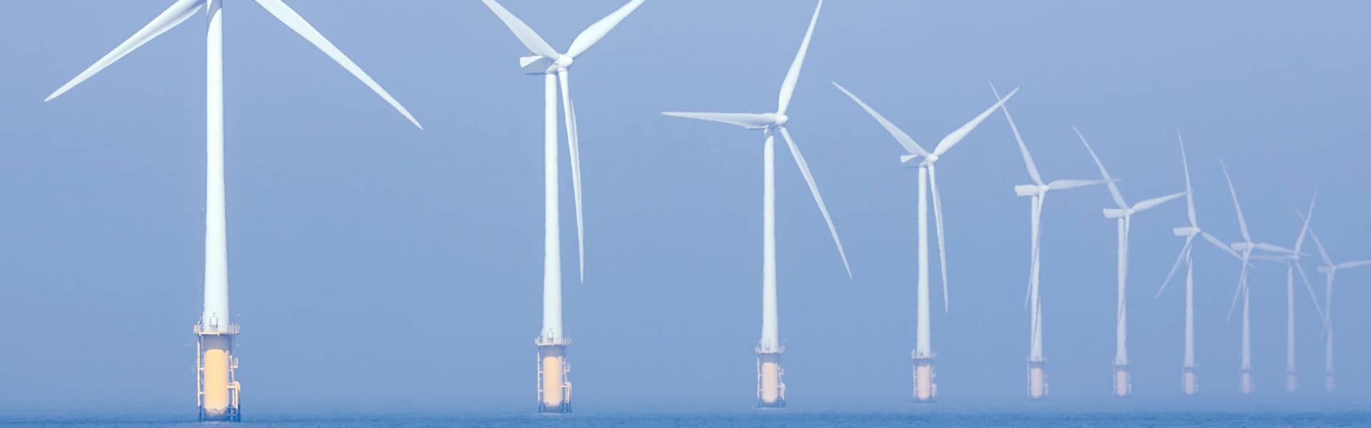 offshore windfarm with 8 3-blade turbines shown