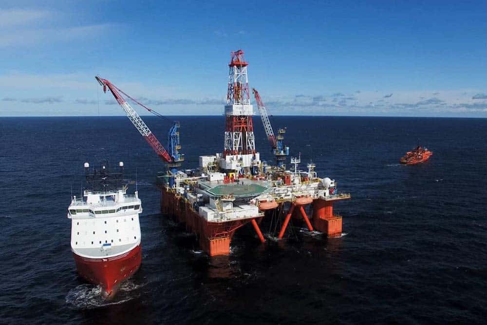 offshore oil rig with supply boat