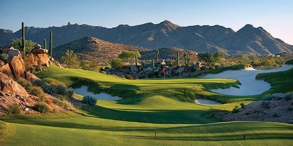 Dessert Golf Course vista with putting green in distance