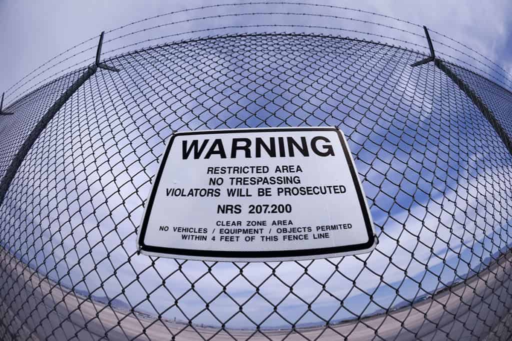 security fence with warning sign