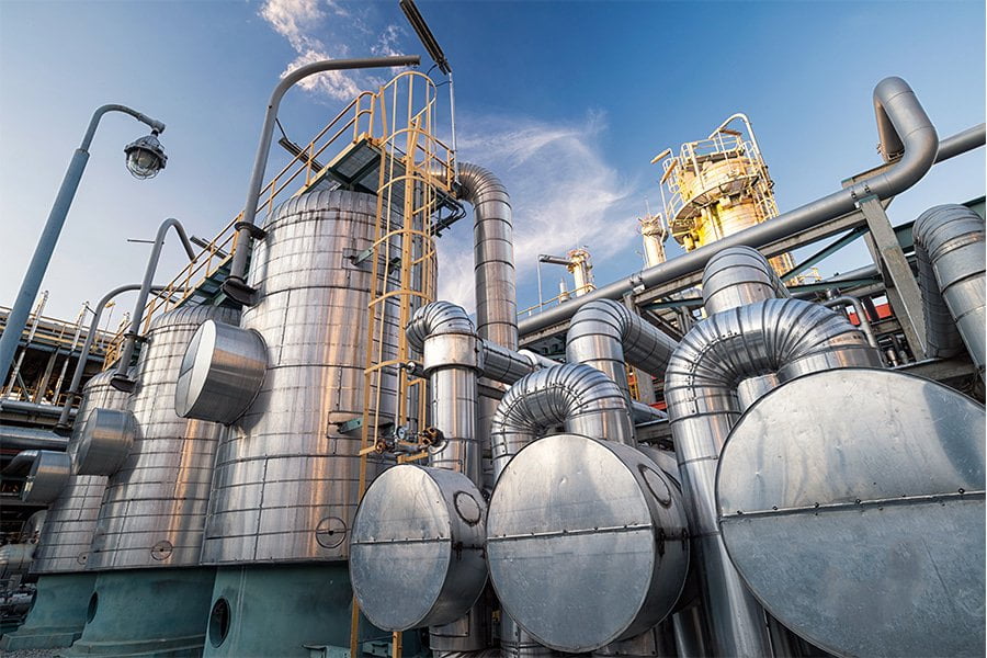 Carbon Capture Facility with metal verticle and horizontal tanks with pipes connecting them